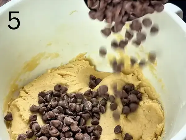 Folding chocolate chips into eggless cookies dough