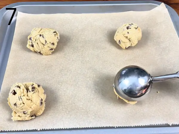 Folding chocolate chips into eggless cookies dough