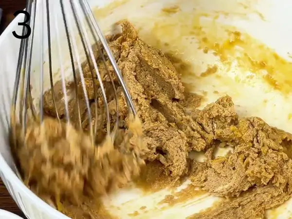 mixing carrot cookie dough ingredients
