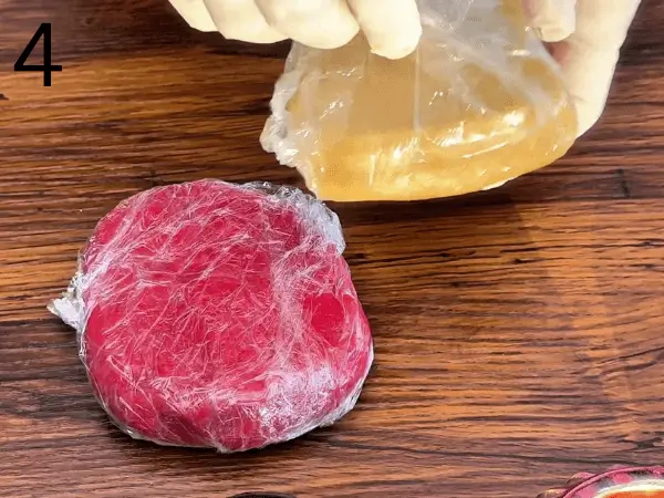 Dividing dough and adding red food coloring