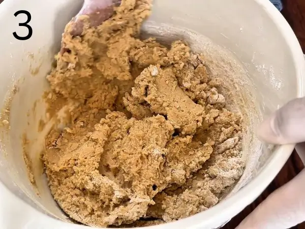 Combining flour with baking soda to form cookie dough