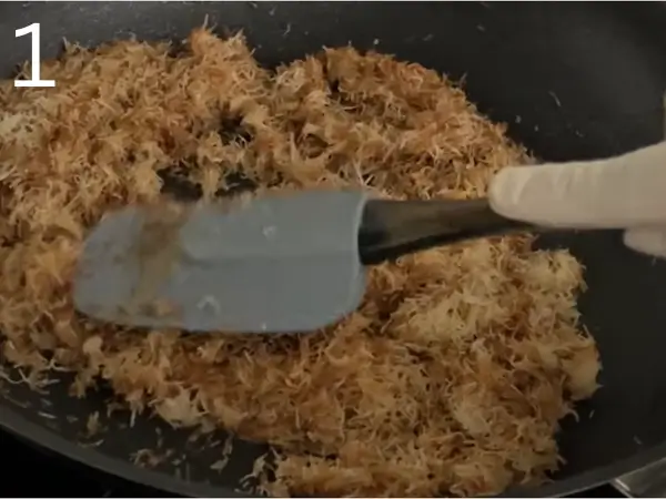 toasting kataifi until golden and crispy in a pan