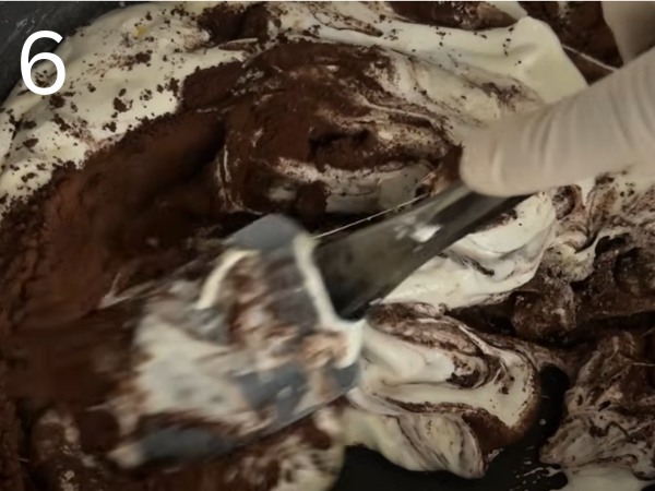 mixing cocoa powder into marshmallow chocolate dough