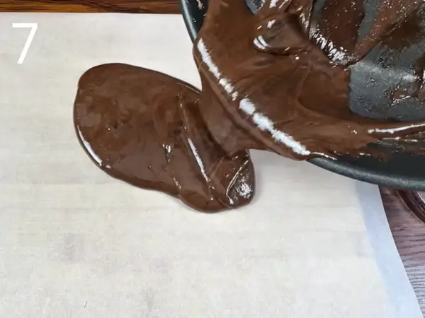 spreading marshmallow cookie dough on parchment paper