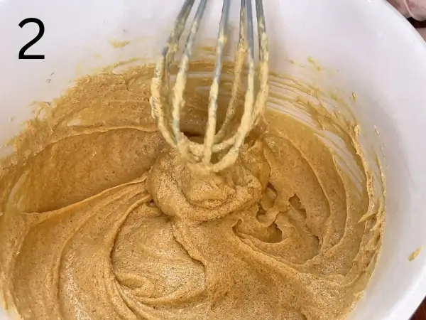 Adding egg and vanilla to chocolate cookie mixture