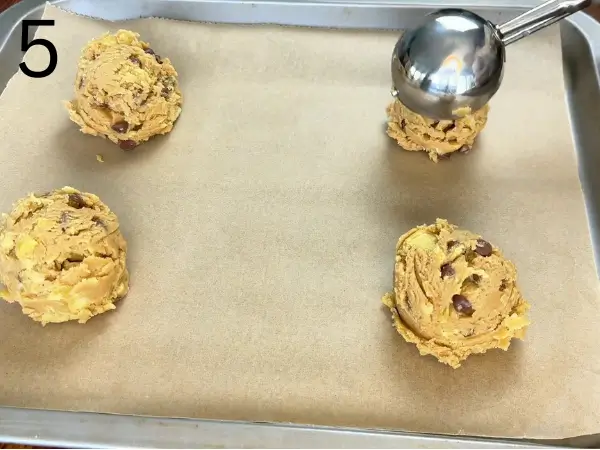 Scooping Crunchy Chocolate Cookies dough onto baking tray