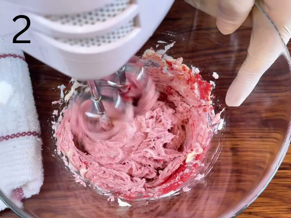 Strawberry cream cheese filling mixed with vanilla and strawberry powder until silky and combined