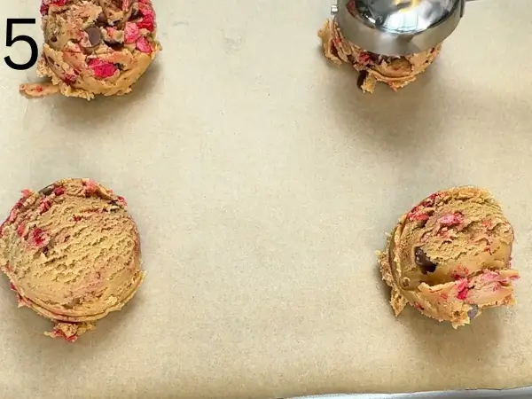 Strawberry Cream Cheese Cookies dough scooped into even cookie balls on tray