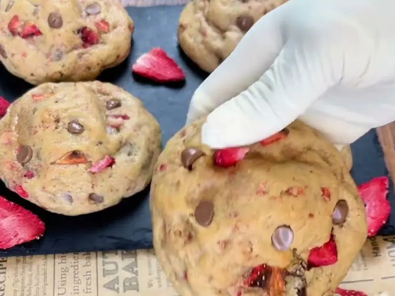 Fresh baked Strawberry Cream Cheese Cookies on tray with golden edges