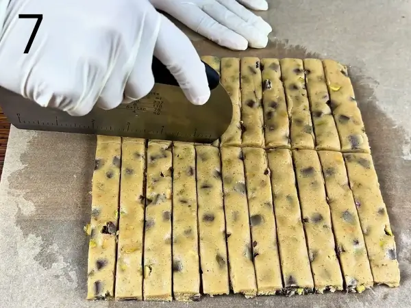 cutting dough into rectangular cookie sticks shapes