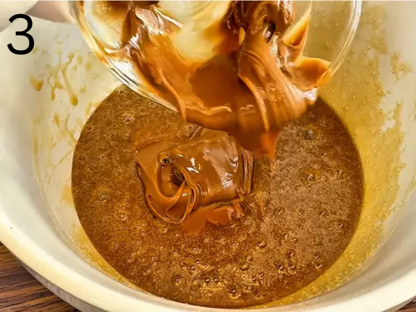 Mixing flour into bakery-style stuffed cookie recipe dough