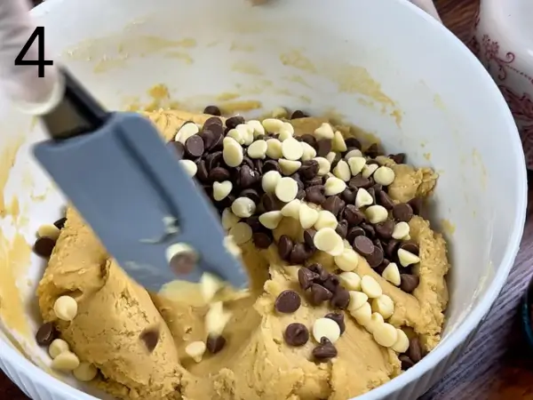 Folding chocolate chips into stuffed chocolate chip cookie dough