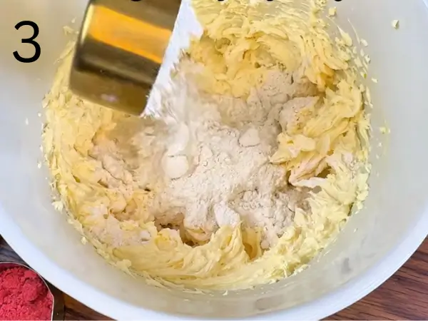 Mixing flour into soft cookie dough
