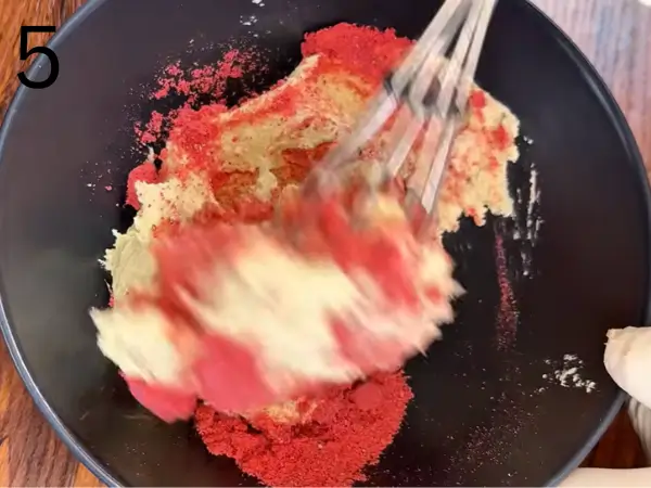 Adding strawberry powder to cookie dough