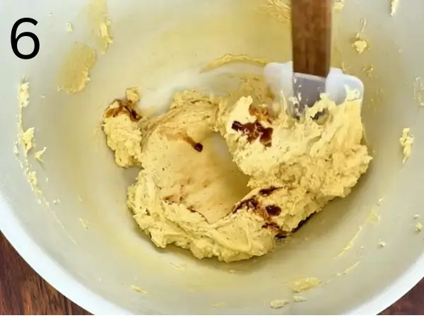 Mixing cocoa powder and vanilla into dough