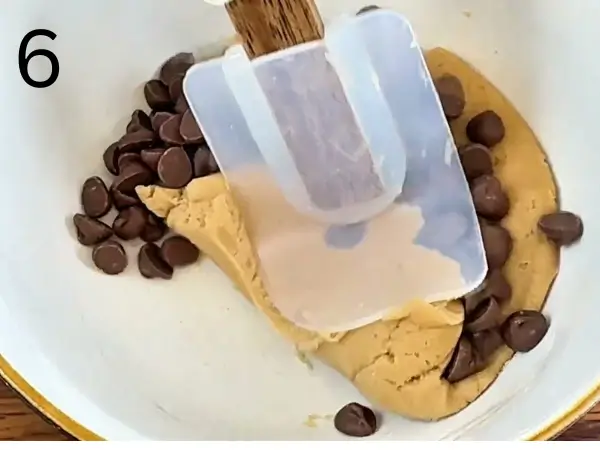 Shaping thick cookie dough on a parchment-lined baking tray