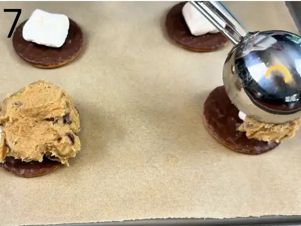 Cookie dough scooped over marshmallows and topped with extra chocolate chips