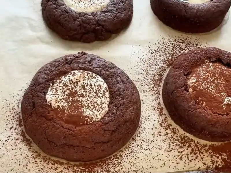 Tiramisu Cookies with creamy mascarpone filling and a dusting of cocoa powder.