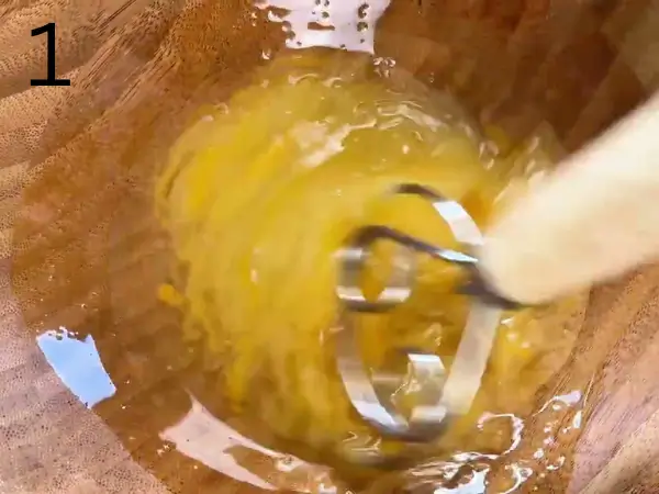 Mixing sugar, egg, vegetable oil, and orange jam for Orange Coconut Cookies dough