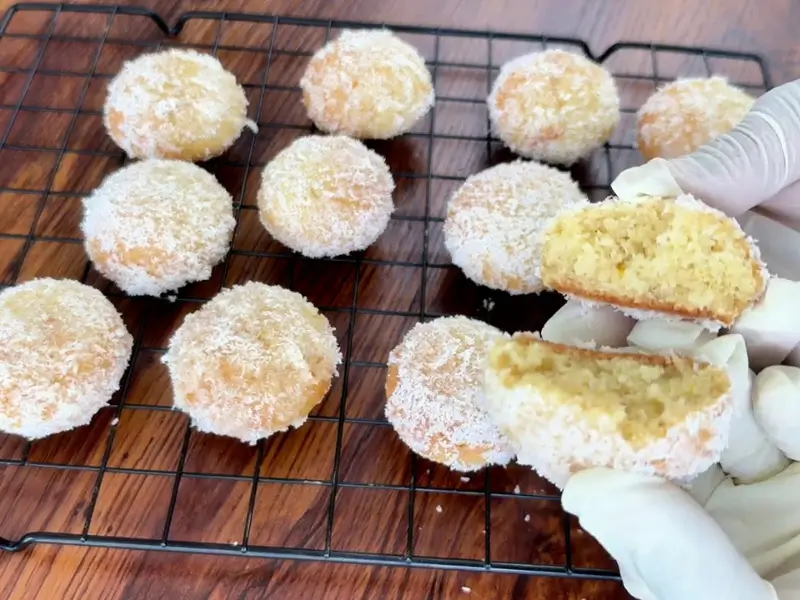 Orange Coconut Cookies coated with orange jam and shredded coconut