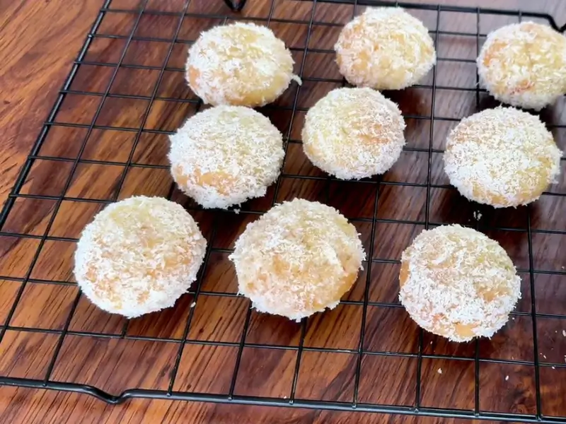 Orange Coconut Cookies coated with orange jam and shredded coconut