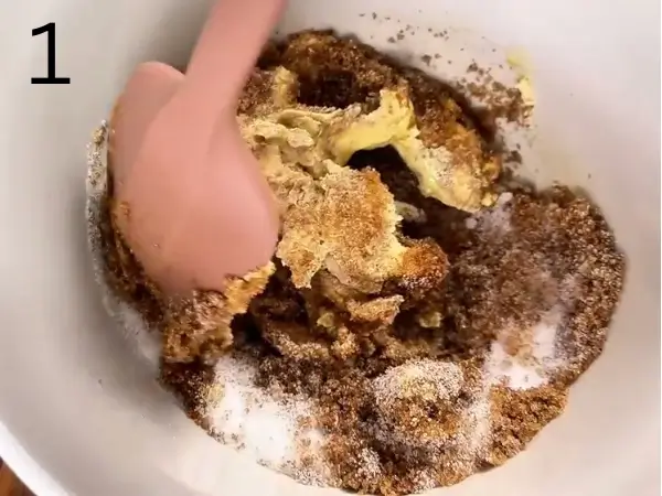 Mixing butter and sugars until smooth